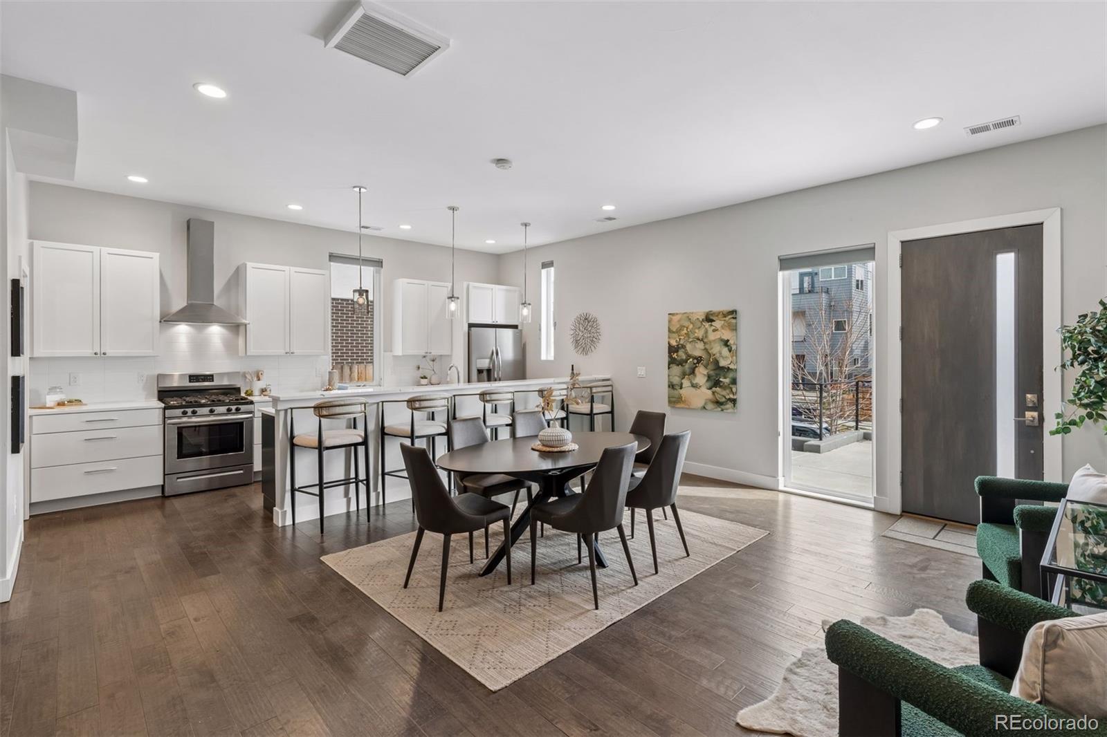 1235 Perry Street Denver, CO 80204 - Photo 6 of 41 a view of a dining room with furniture and wooden floor
