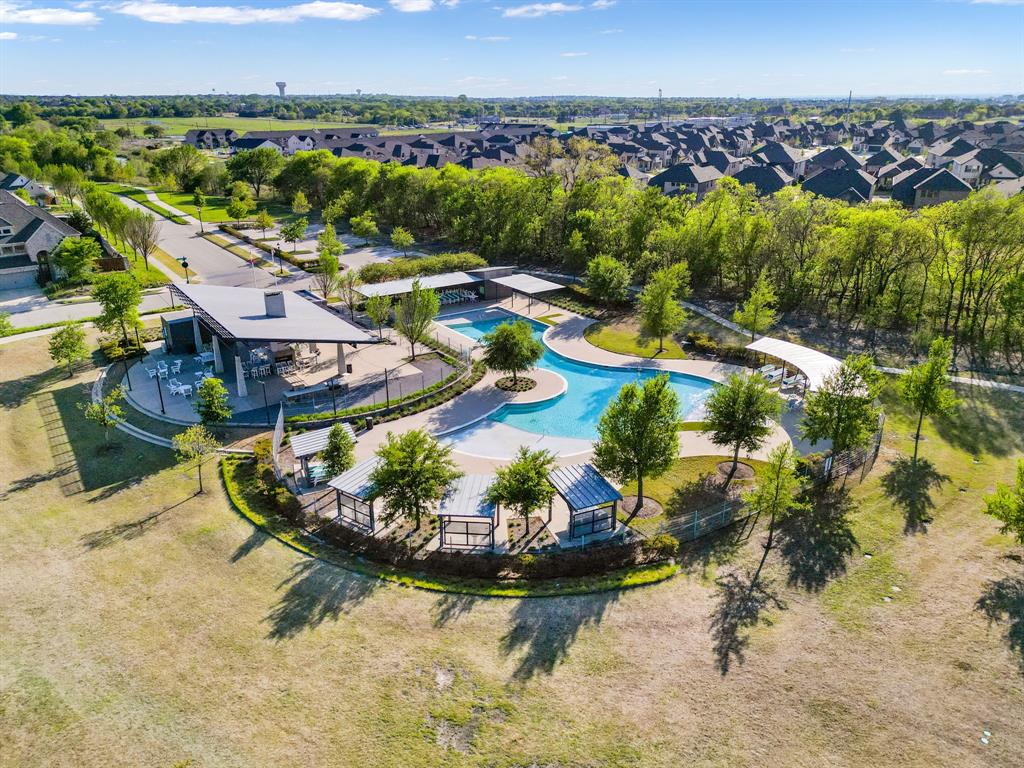 1501 Snowdrop Drive Prosper, TX 75078 - Photo 8 of 27 an aerial view of residential houses with outdoor space and swimming pool