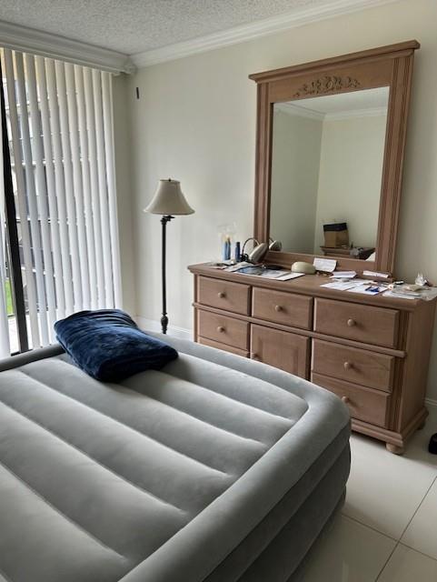 3590 Blue Lake Drive, Unit 305 Pompano Beach, FL 33064 - Photo 11 of 23 a living room with furniture and a mirror