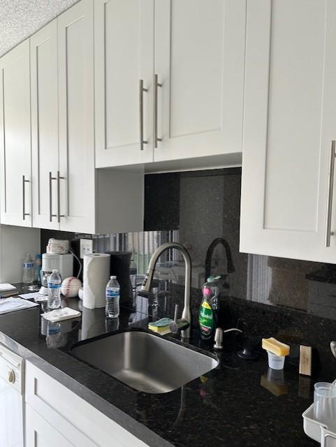 3590 Blue Lake Drive, Unit 305 Pompano Beach, FL 33064 - Photo 12 of 23 a kitchen with a sink and cabinets