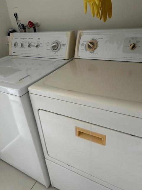 3590 Blue Lake Drive, Unit 305 Pompano Beach, FL 33064 - Photo 17 of 23 a close up view of washer and dryer