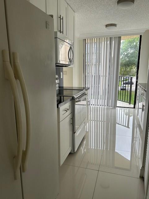 3590 Blue Lake Drive, Unit 305 Pompano Beach, FL 33064 - Photo 20 of 23 a utility room with dryer and washer