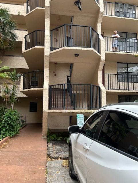 3590 Blue Lake Drive, Unit 305 Pompano Beach, FL 33064 - Photo 3 of 23 a view of building with outdoor space