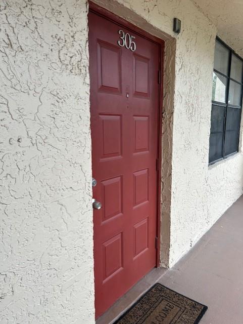 3590 Blue Lake Drive, Unit 305 Pompano Beach, FL 33064 - Photo 4 of 23 a view of door