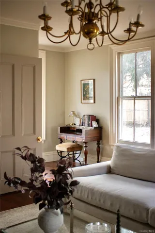 a bedroom with furniture and a window