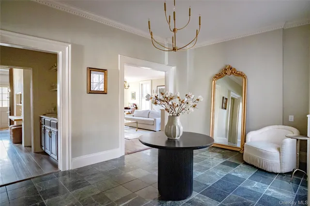 a view of living room with furniture and wooden floor