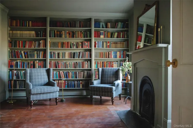 a view of a livingroom with a bookshelf and a bookshelf