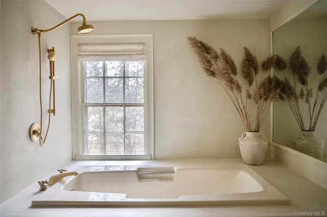 a bathroom with a bathtub and a sink