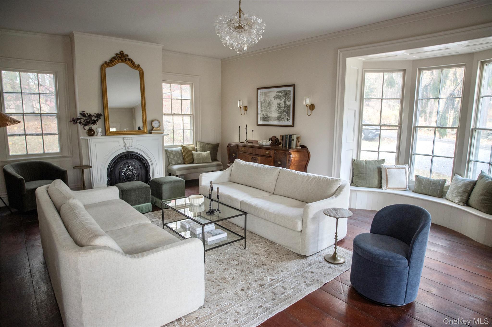 5091 Rte 9W Newburgh, NY 12550 - Photo 7 of 46 a living room with furniture a fireplace and a chandelier