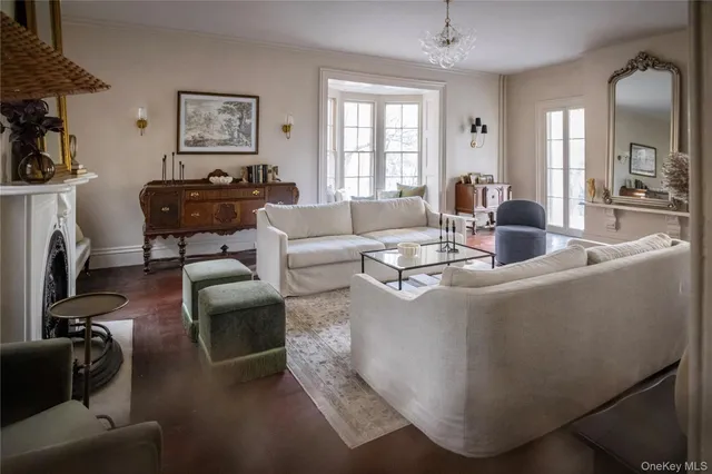a living room with fireplace furniture and a window