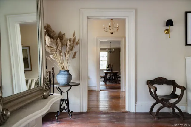 a view of a livingroom with furniture and hardwood floor