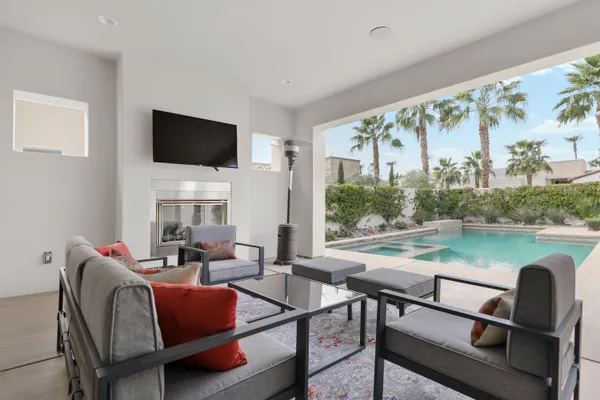 a living room with furniture and a large window