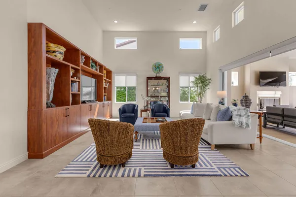 a view of a a dining room with furniture window and wooden floor