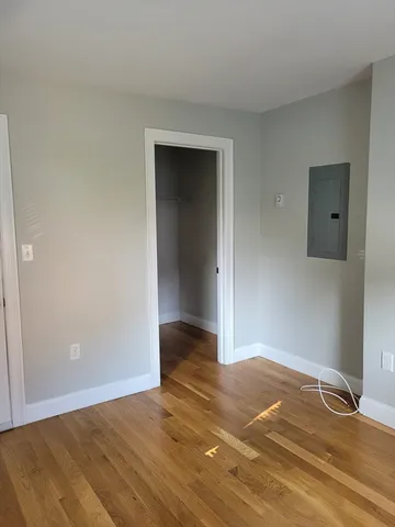a view of an empty room and wooden floor
