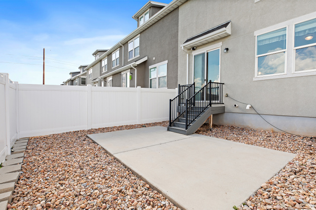 2343 Wysteria Drive Mapleton, UT 84664 - Photo 28 of 30 Doorway to property featuring stucco siding and a patio area