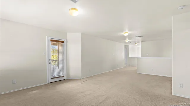 an empty room with a empty space and windows