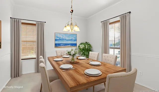 a view of a dining room with furniture and window
