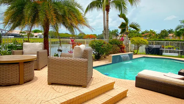 a view of swimming pool with seating area