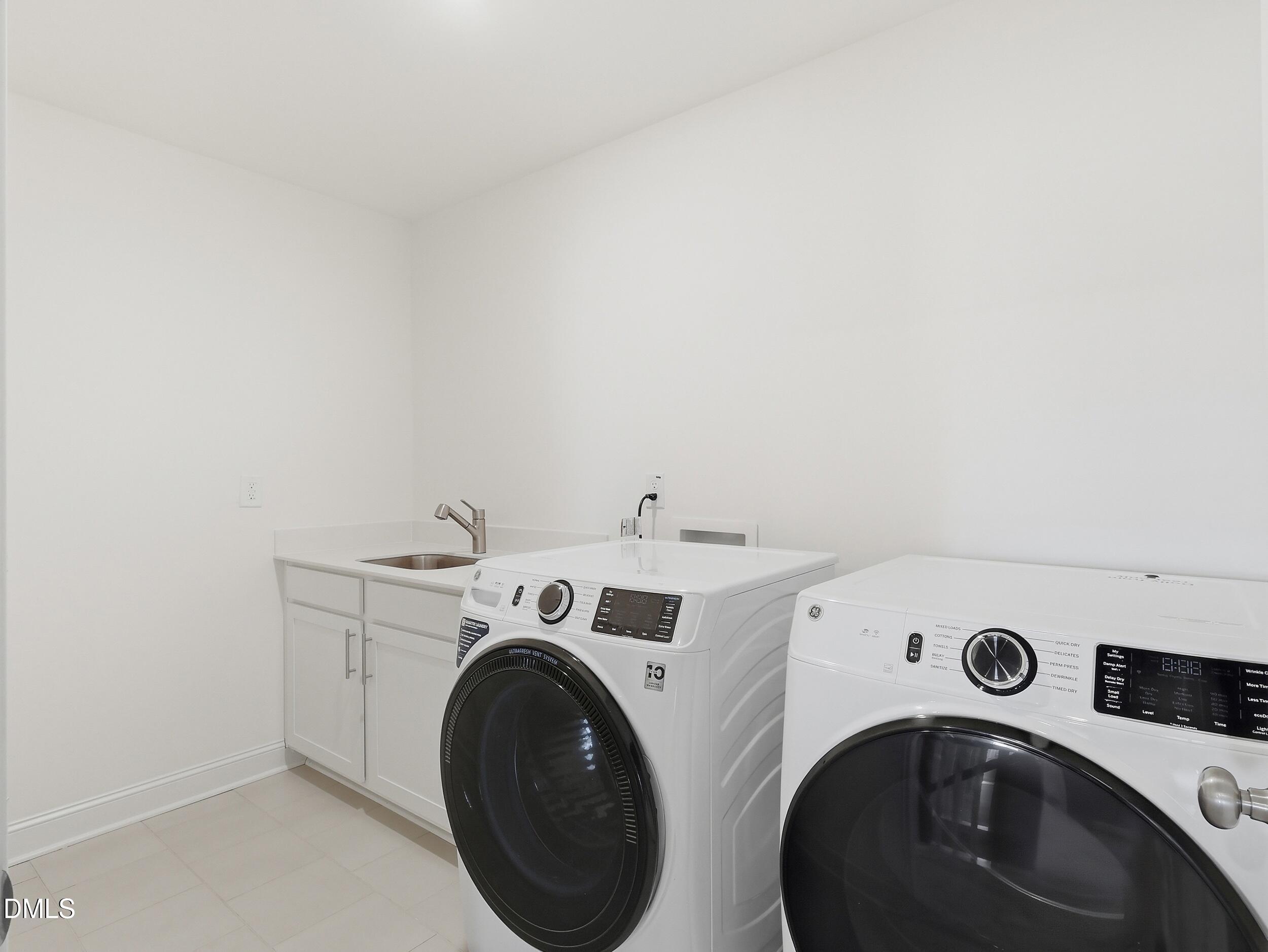 2709 Womble Ridge Drive New Hill, NC 27562 - Photo 27 of 60 a utility room with dryer and washer