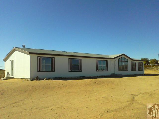 56579 Cubero Road Landers, CA 92285 - Photo 2 of 13 a house view with a outdoor space