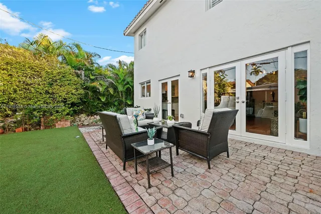 a living room with furniture and a garden
