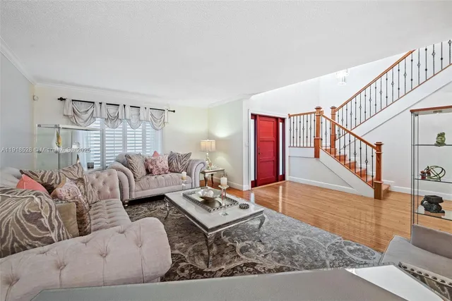 a living room with furniture and a rug