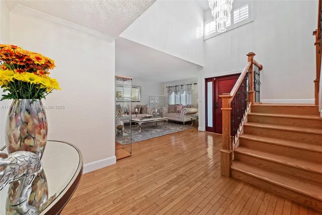 a view of a livingroom with furniture and hardwood floor