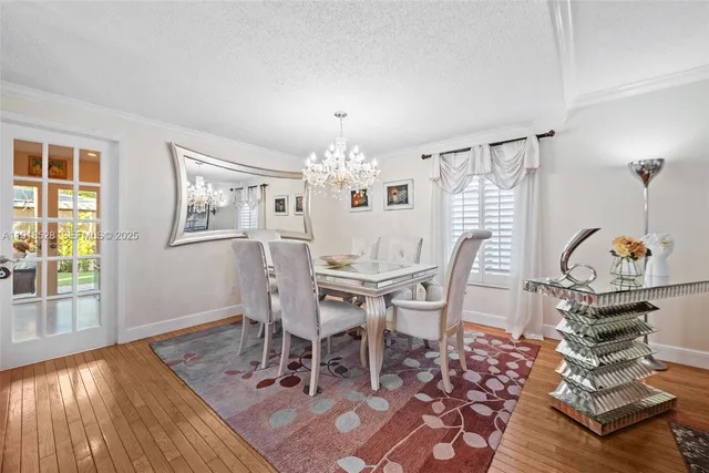 a dining room with wooden floor and breakfast area