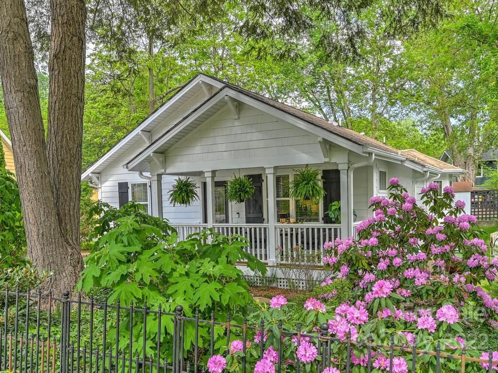 a view of a house with a flower garden