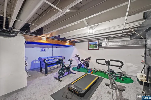 a view of a house with wooden deck and furniture