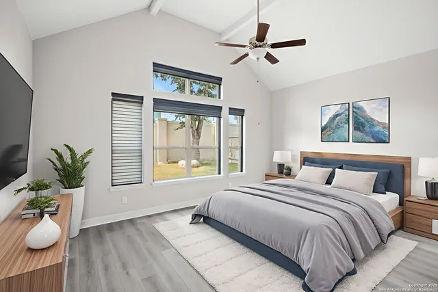 a bedroom with a large bed and a window