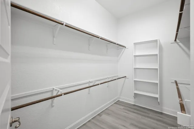 a view of an empty walk in closet