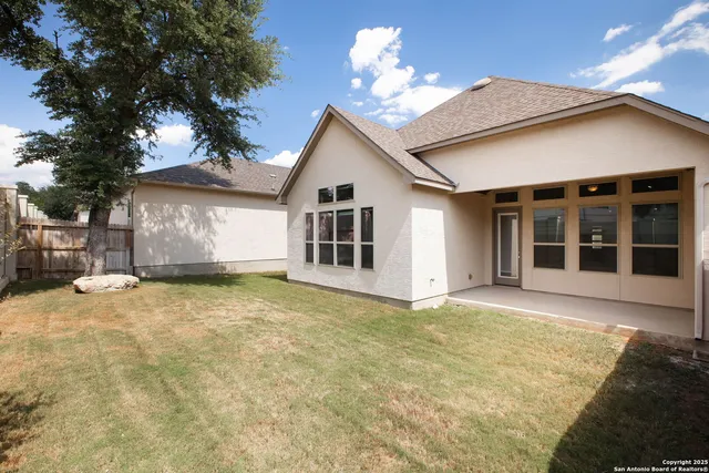 a view of a house with a yard and garage