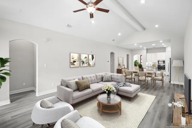 a living room with furniture and a rug