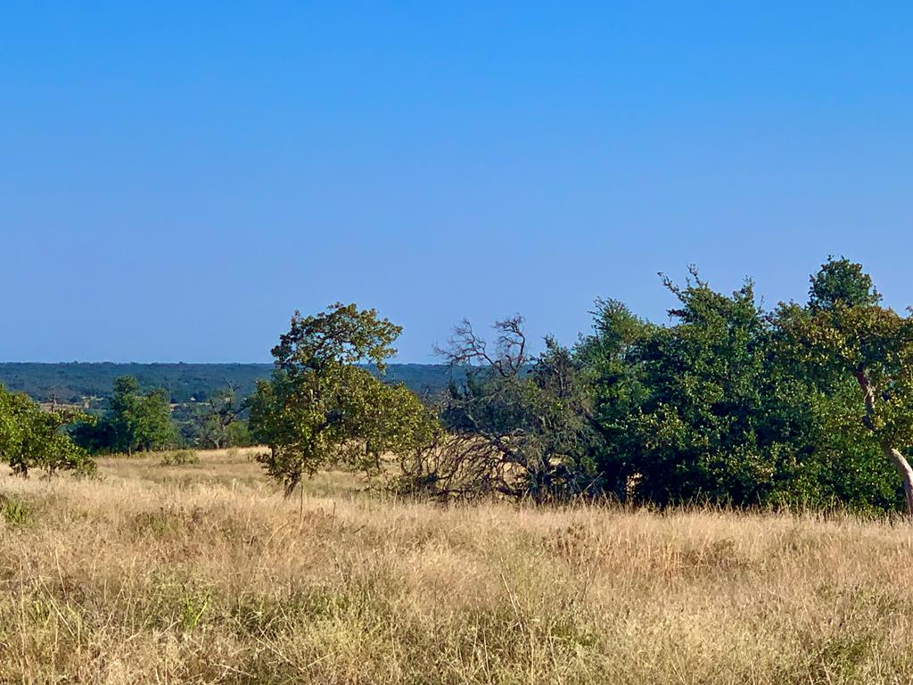 Lot 37 Dancing Sun Road, Unit 37 Fredericksburg, TX 78624 - Photo 8 of 13 a view of a lake and a yard