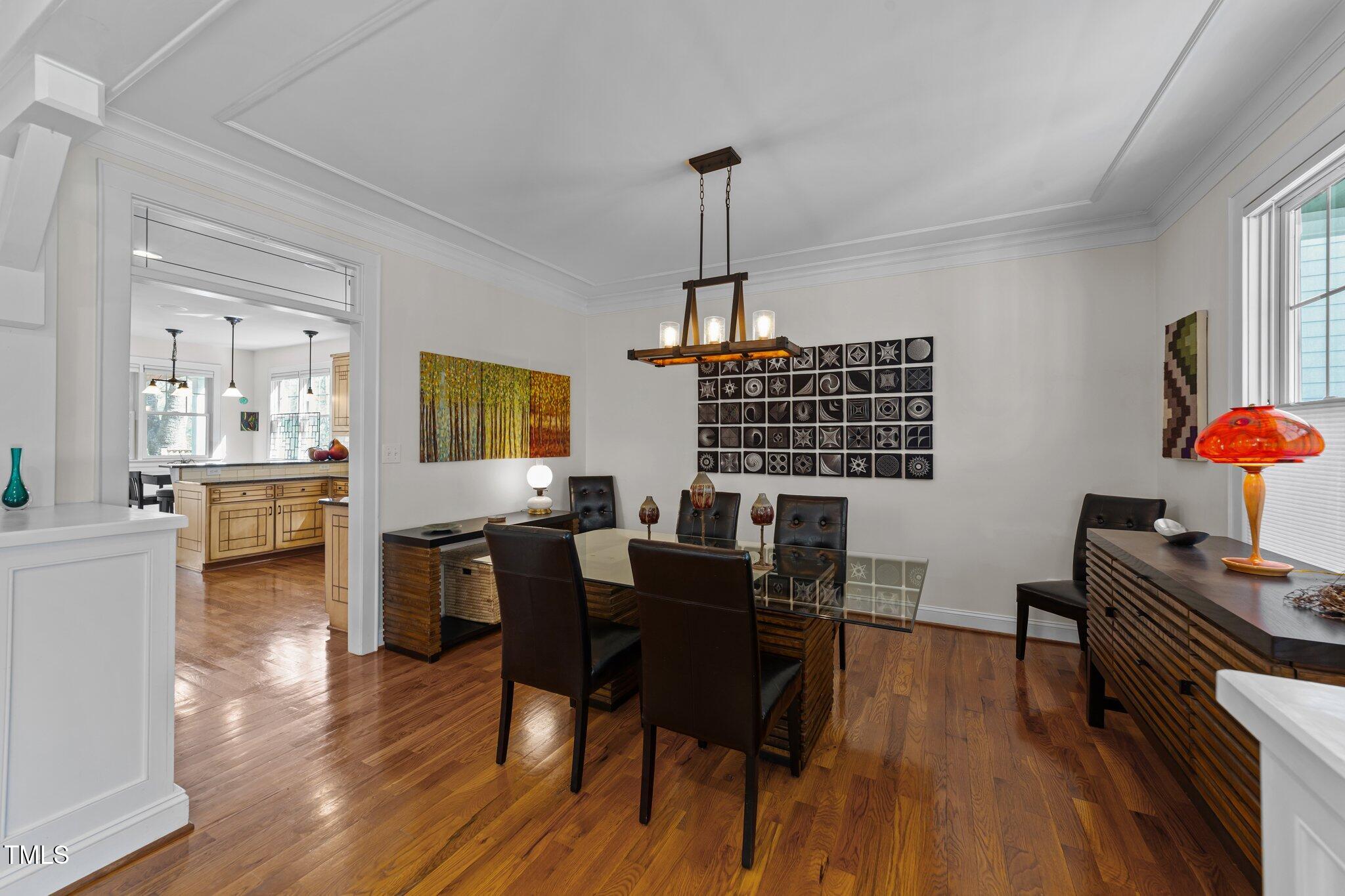 2506 Everett Avenue Raleigh, NC 27607 - Photo 8 of 45 a view of a dining room with furniture and wooden floor