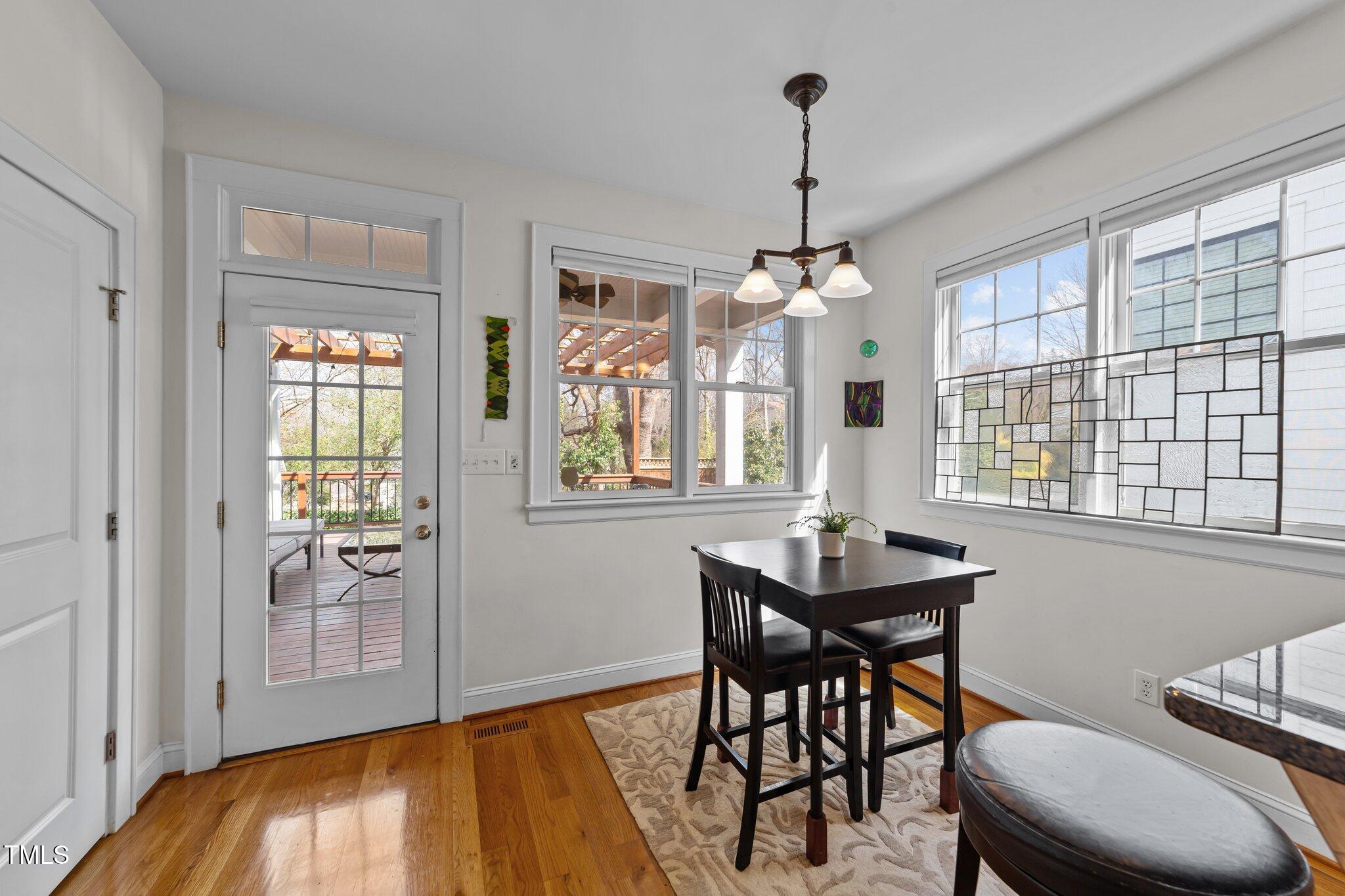 2506 Everett Avenue Raleigh, NC 27607 - Photo 12 of 45 a dining room with furniture window wooden floor