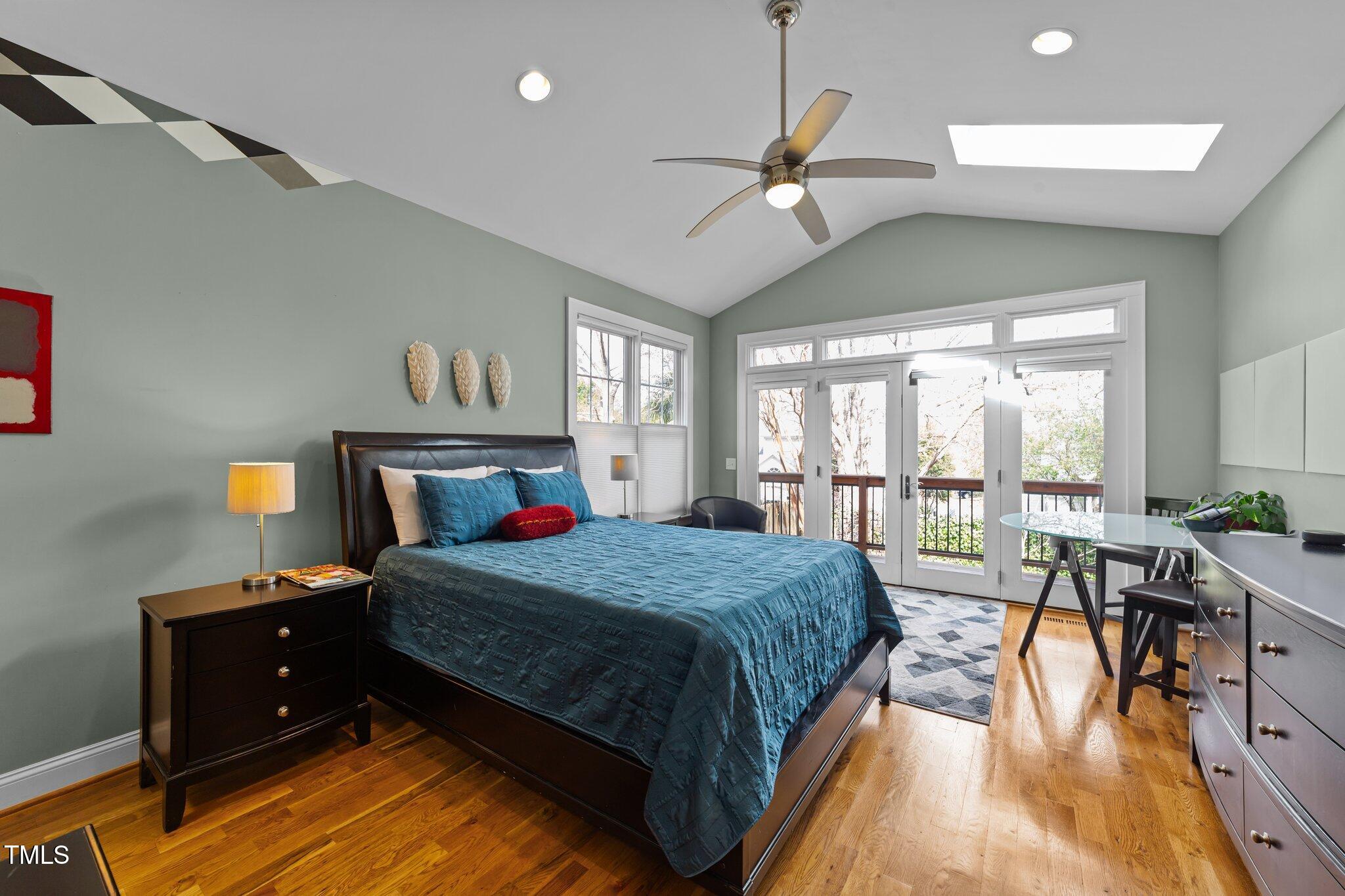 2506 Everett Avenue Raleigh, NC 27607 - Photo 13 of 45 a bedroom with a bed and wooden floor
