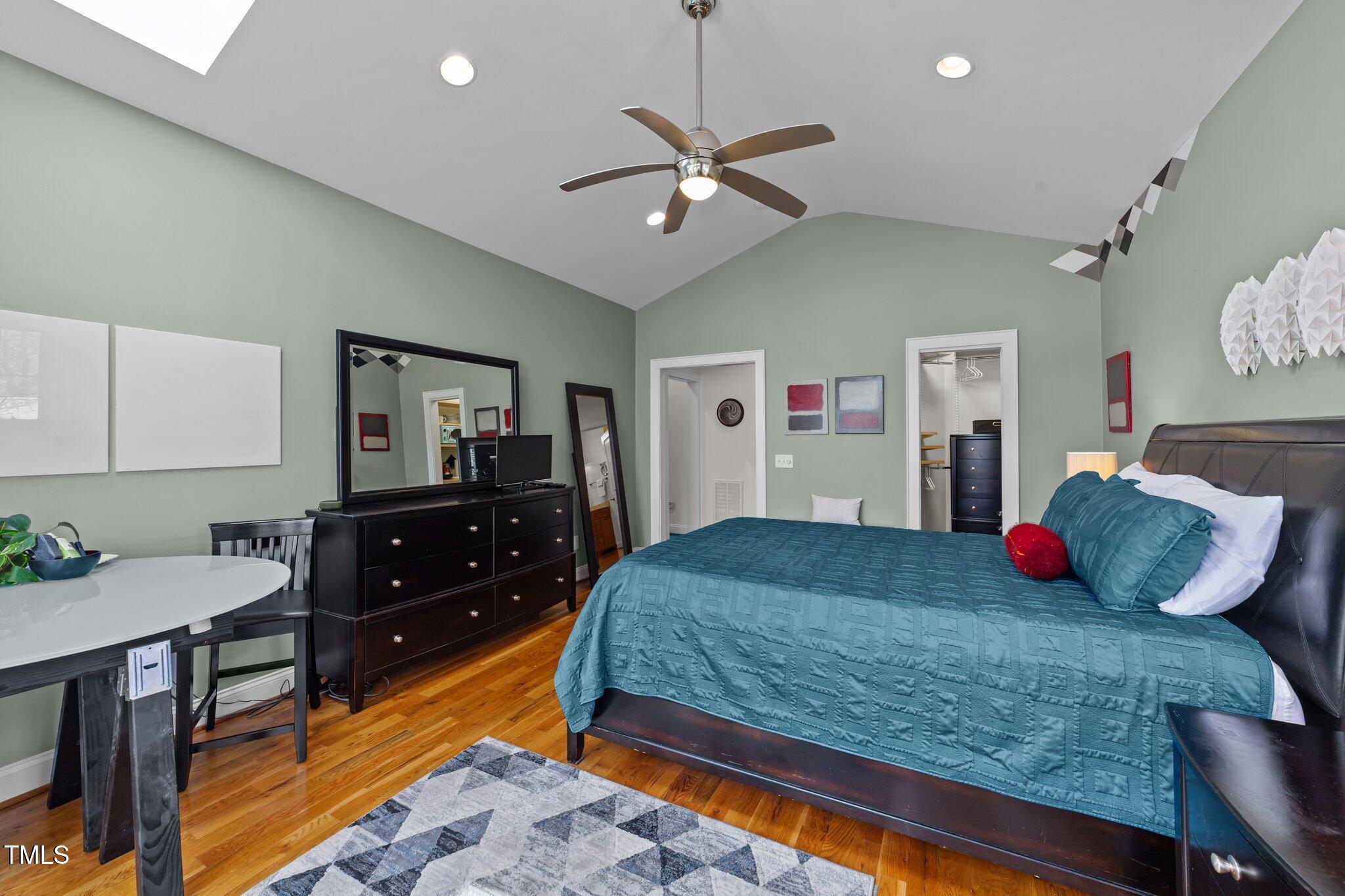 2506 Everett Avenue Raleigh, NC 27607 - Photo 15 of 45 a bedroom with a bed and a dresser in it