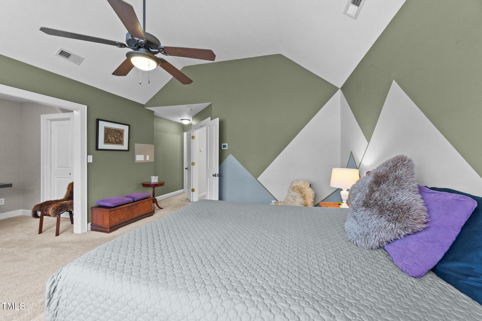 2506 Everett Avenue Raleigh, NC 27607 - Photo 22 of 45 a bedroom with a bed and dresser