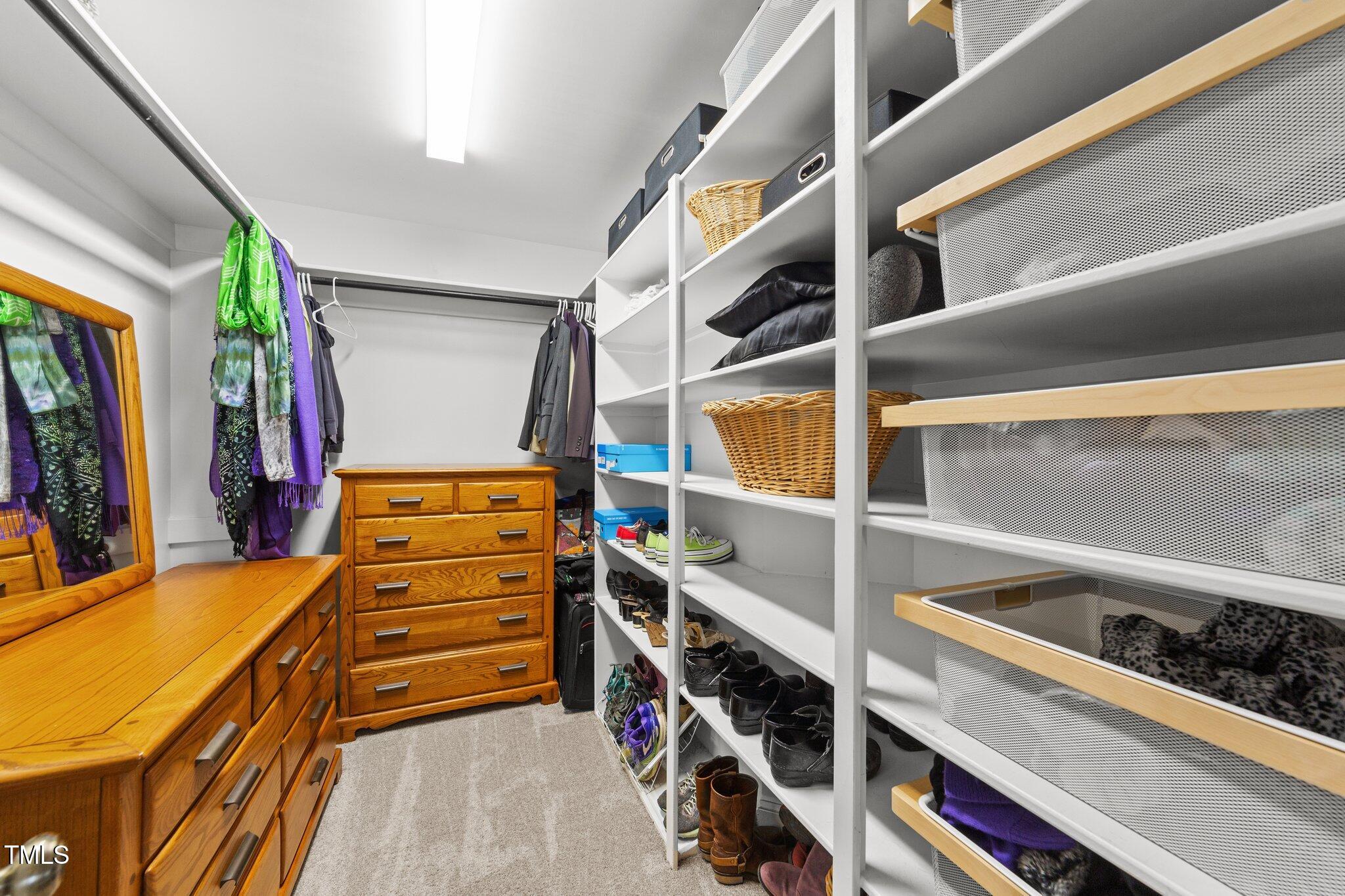 2506 Everett Avenue Raleigh, NC 27607 - Photo 25 of 45 a view of walk in closet with clothes and shoes