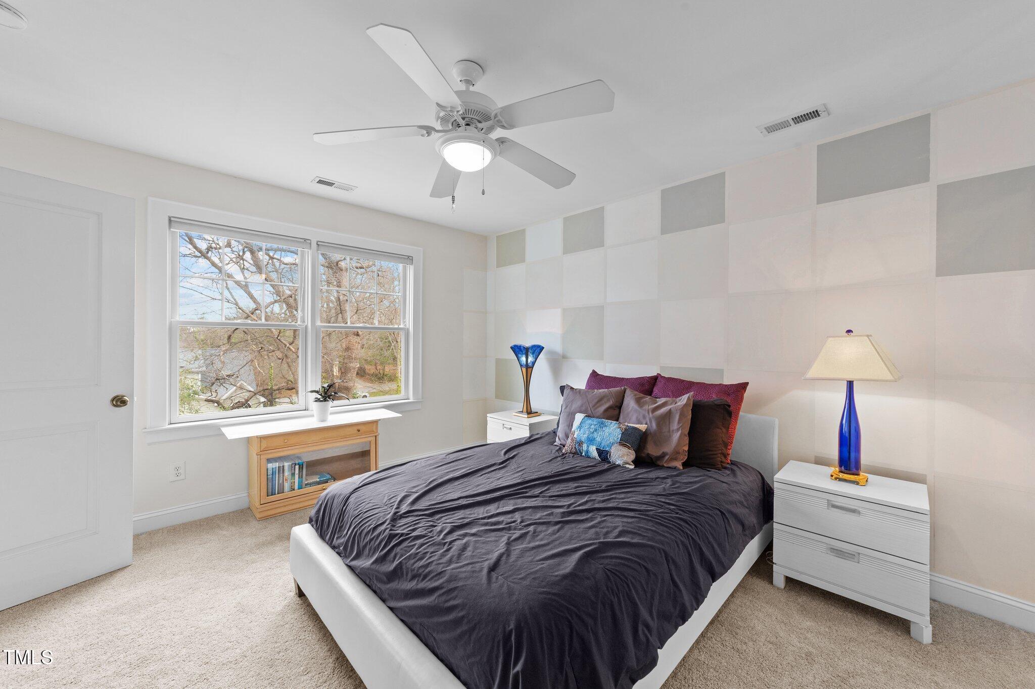 2506 Everett Avenue Raleigh, NC 27607 - Photo 28 of 45 a bedroom with a bed and a table