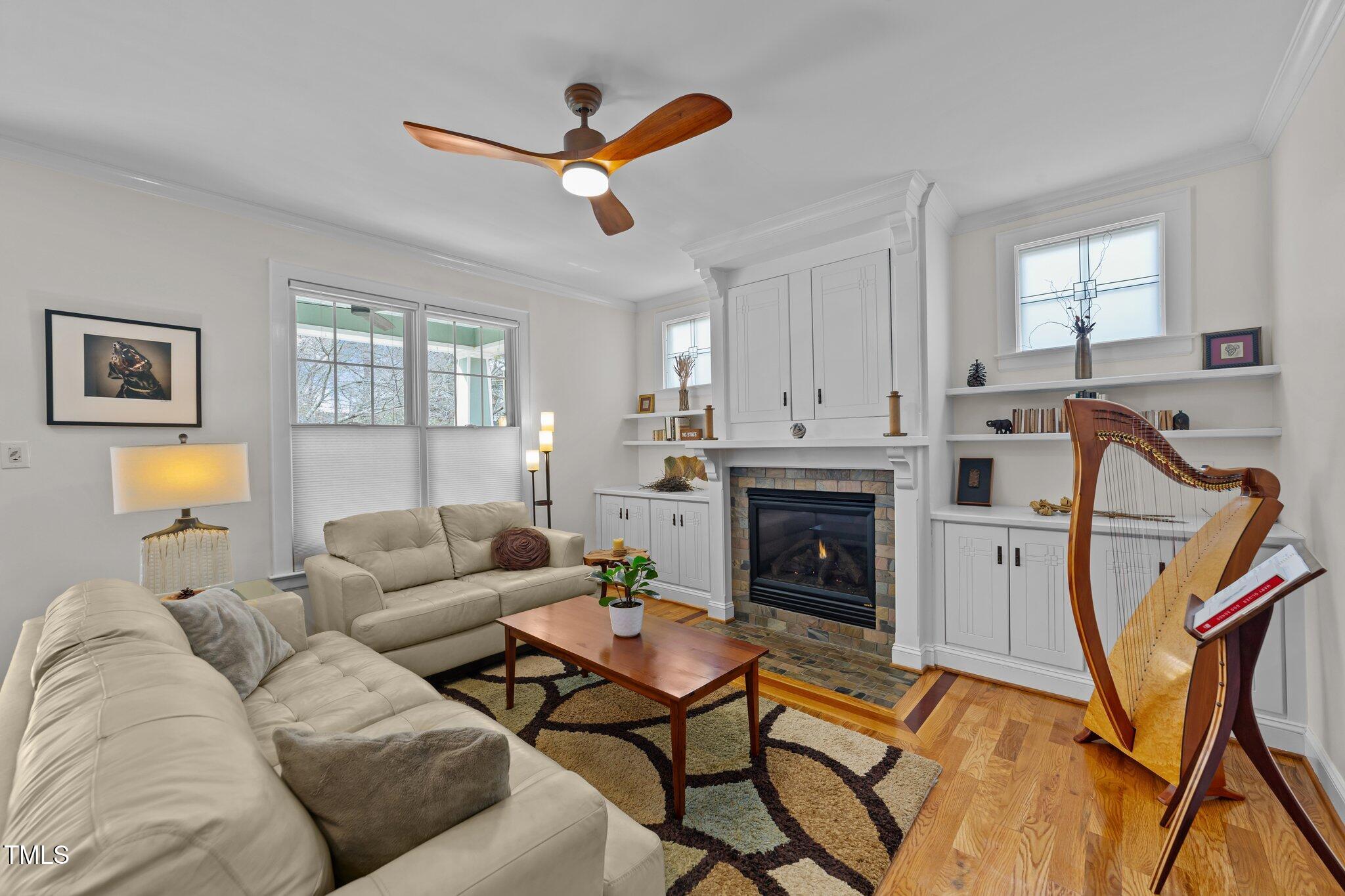 2506 Everett Avenue Raleigh, NC 27607 - Photo 5 of 45 a living room with furniture and a fireplace