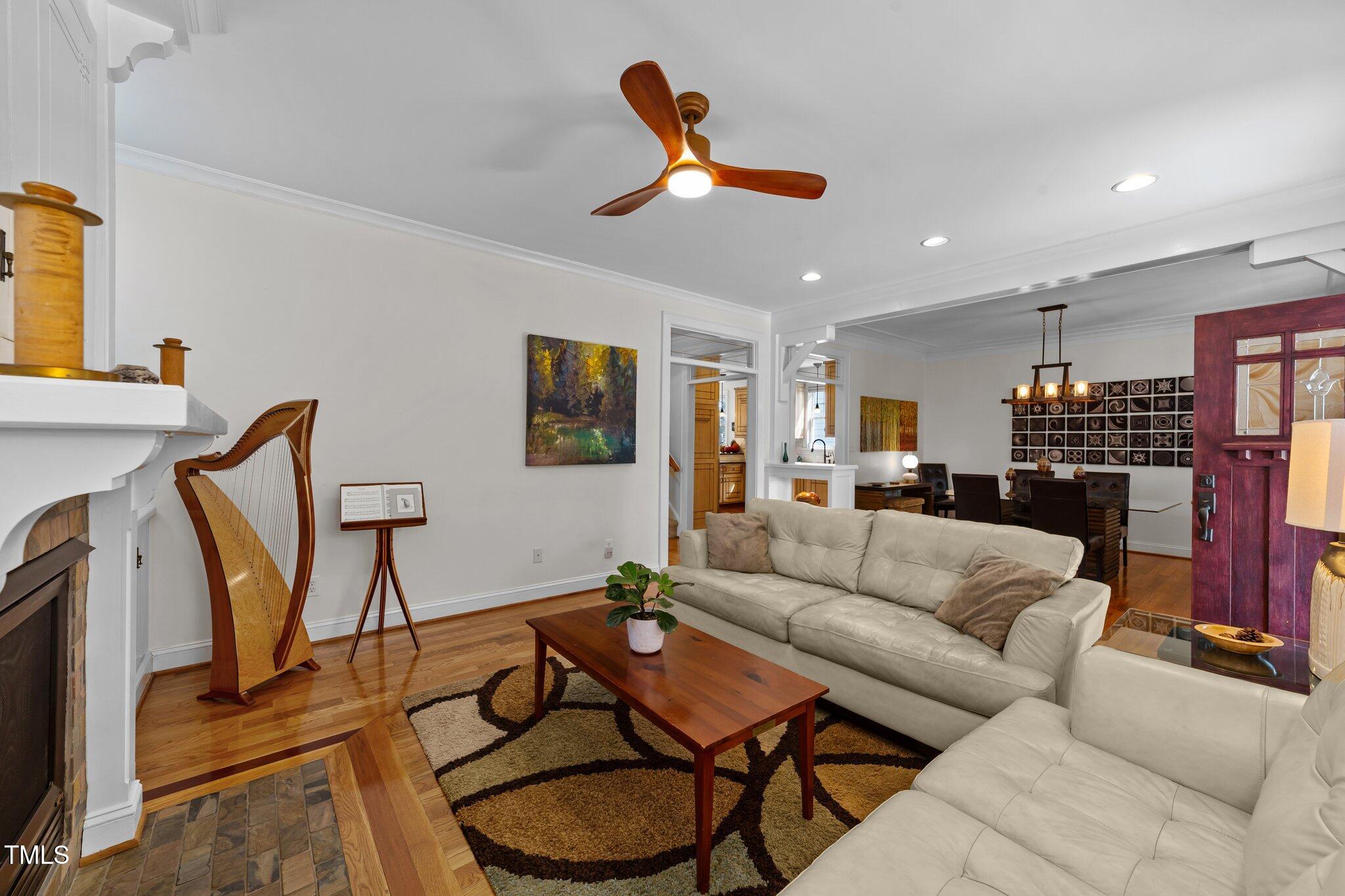 2506 Everett Avenue Raleigh, NC 27607 - Photo 7 of 45 a living room with furniture a ceiling fan and a rug