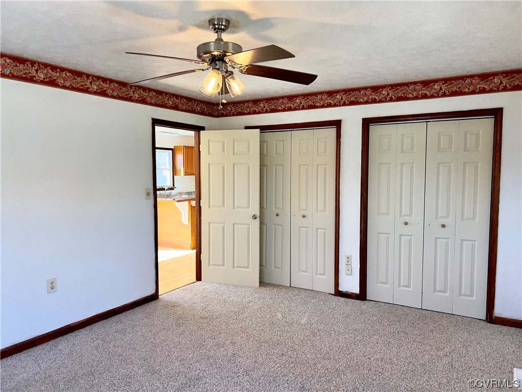 2720 Scuffletown Road Rice, VA 23966 - Photo 11 of 31 a view of a livingroom with a chandelier fan and windows