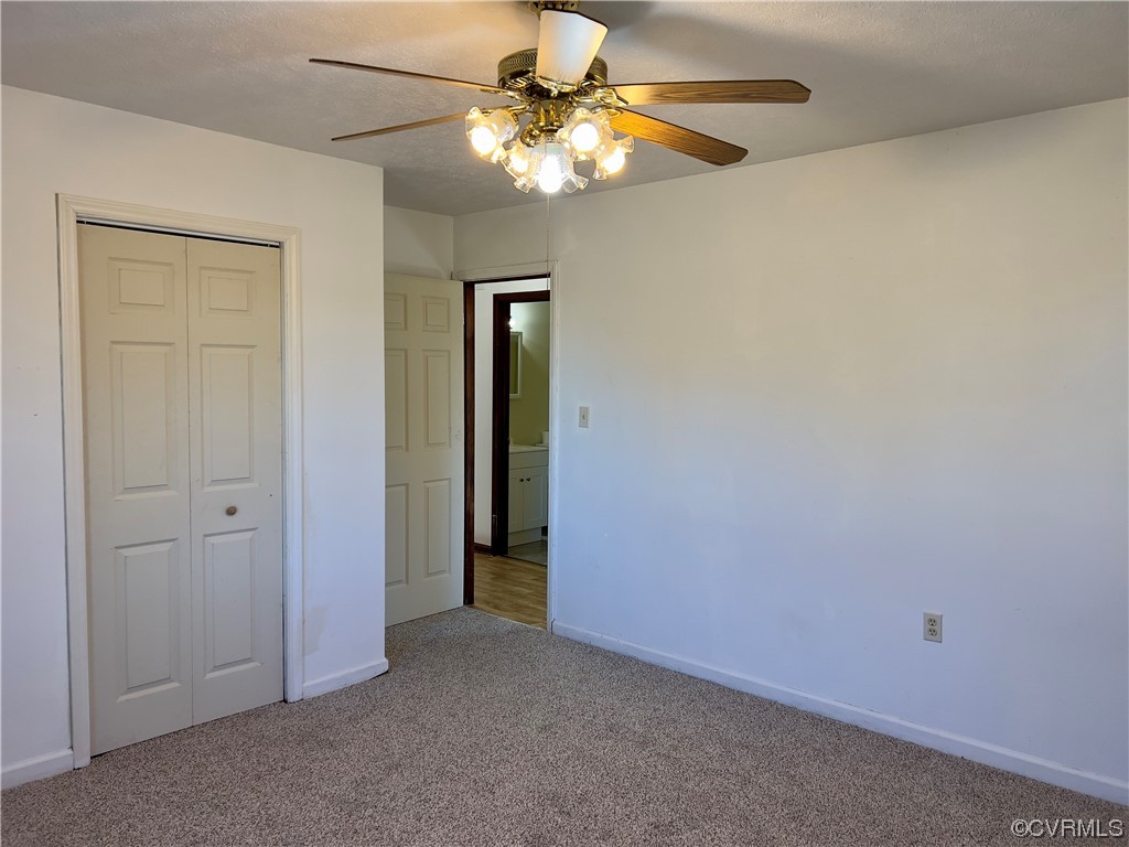 2720 Scuffletown Road Rice, VA 23966 - Photo 14 of 31 an empty room with a fan and a ceiling fan