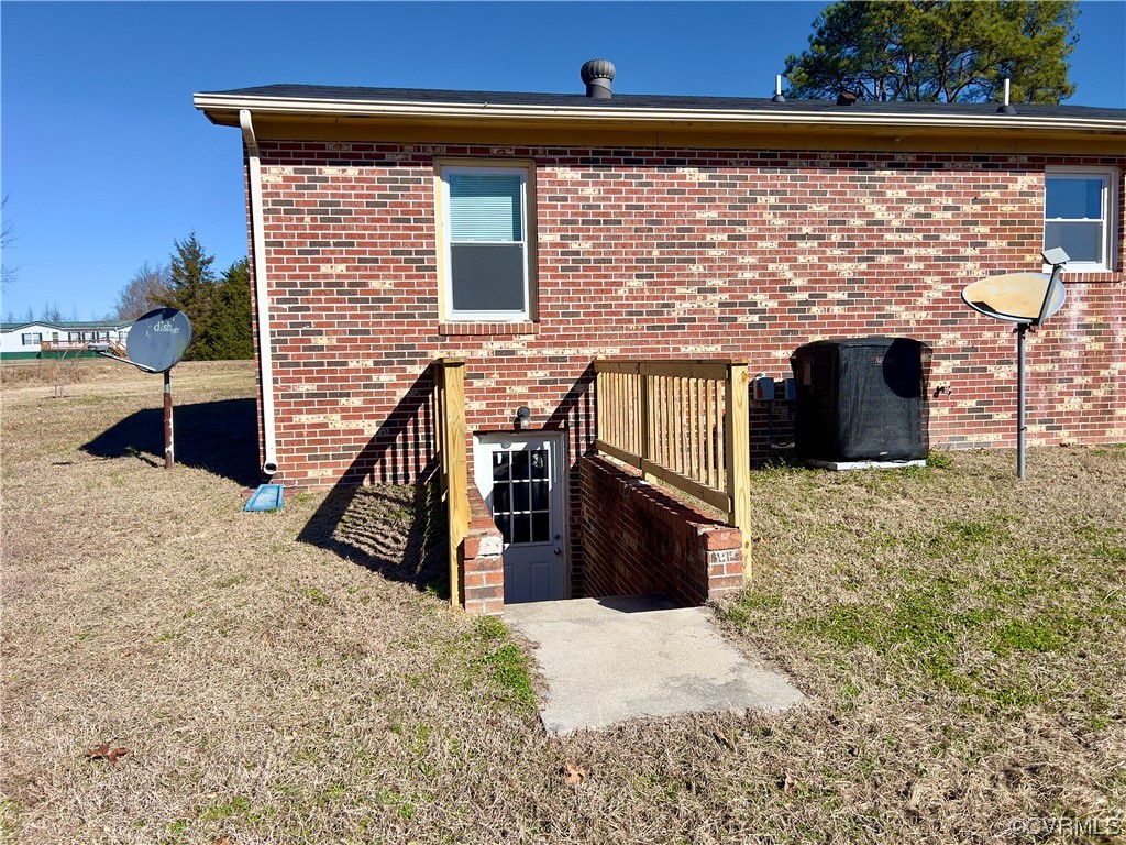 2720 Scuffletown Road Rice, VA 23966 - Photo 21 of 31 a view of a terrace with wooden fence and a floor to ceiling window