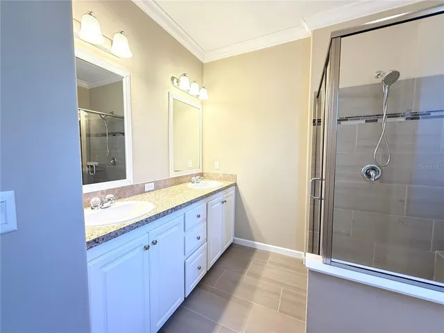 a bathroom with a granite countertop sink mirror and double