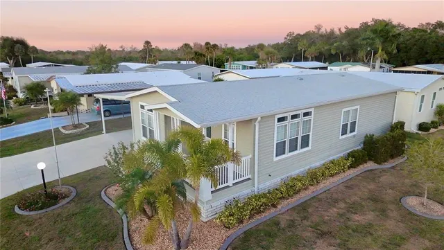 a aerial view of a house with a yard
