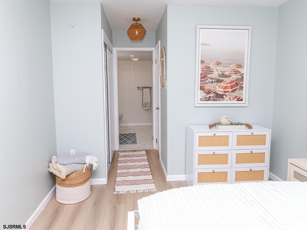 3901 Ocean Avenue, Unit 1 Brigantine, NJ 08203 - Photo 18 of 30 a bedroom with a bed and a window